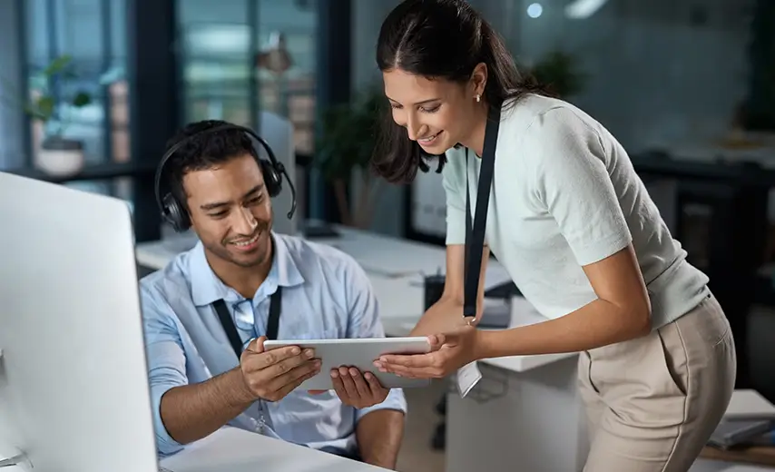 Shot of a man and woman using technical services